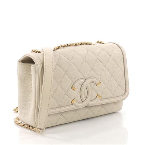 chanel filigree flap beige black|Chanel black flap bag.